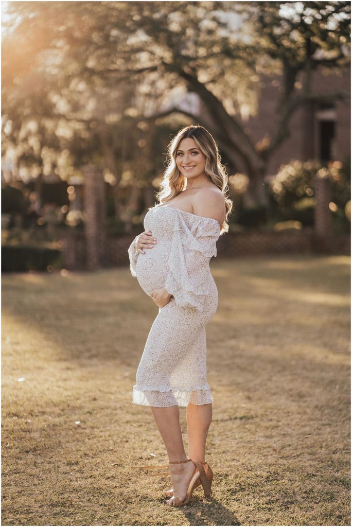 Expecting momma holding a belly for maternity photos