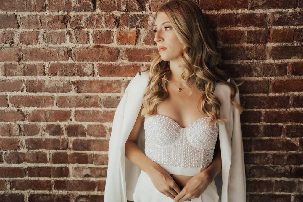 woman in trendy white pearl crop top | Pompy Portraits