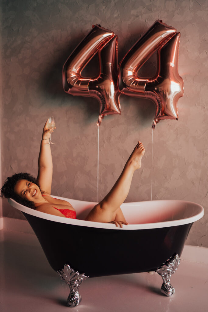 Woman in tub celebrating life transition of her birthday