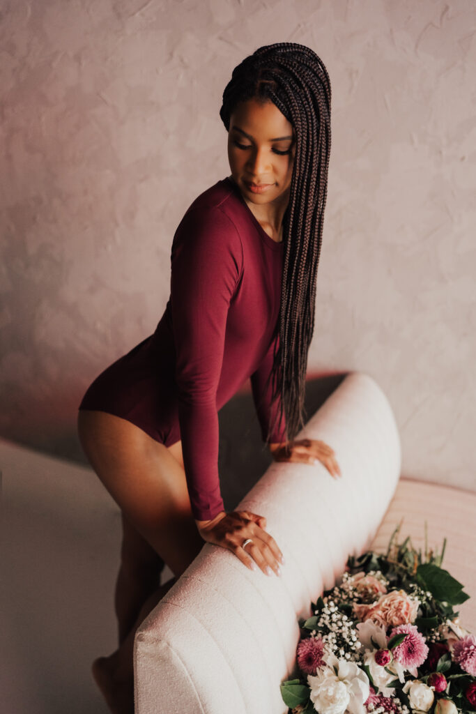 woman posing against couch